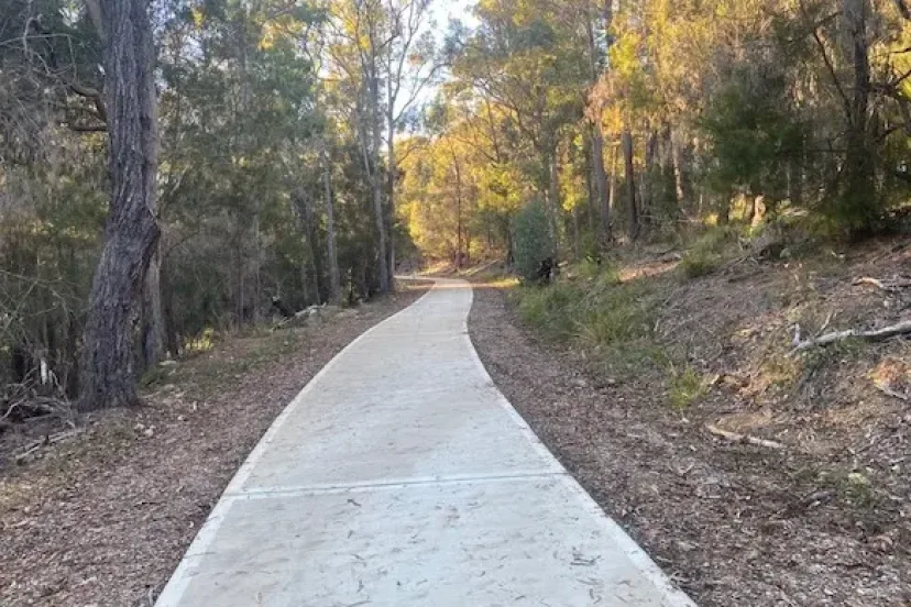 Concrete shared path winding through bushland between Kalaru and Tathra