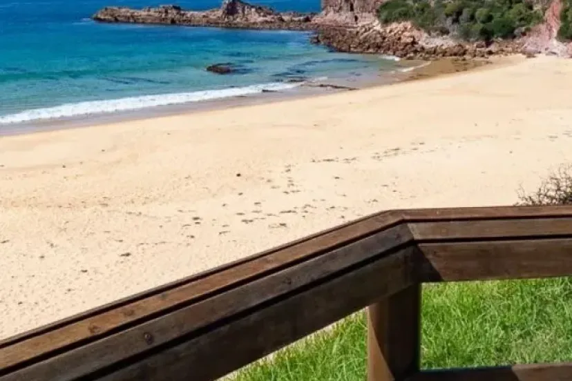 Beach and rocky point from the timber railing on the Tura to Bournda route