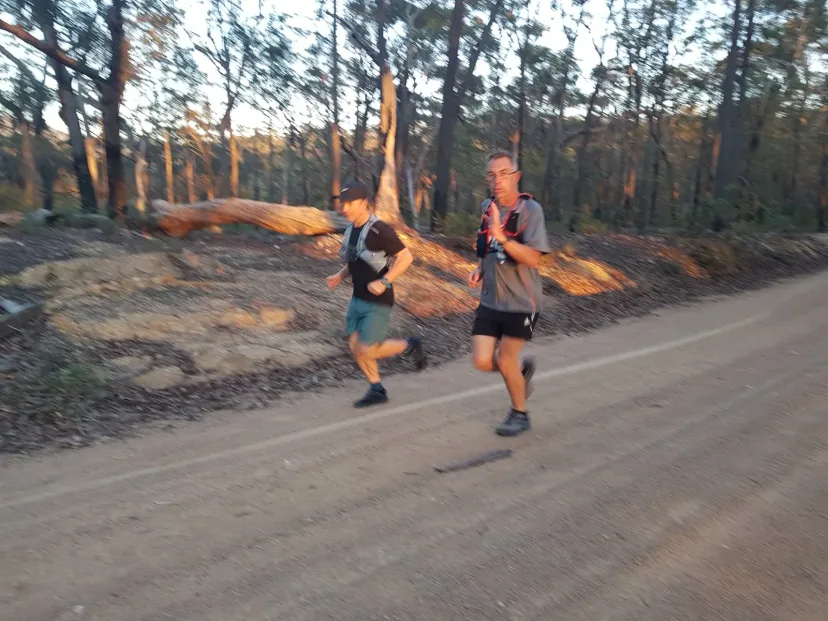 Two Sapphire Coast Runners members running a bush trail together