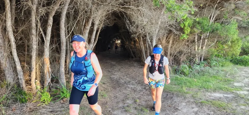 Two Sapphire Coast Runners members running a bush trail together