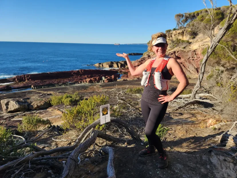 Club member running the coast path above the ocean