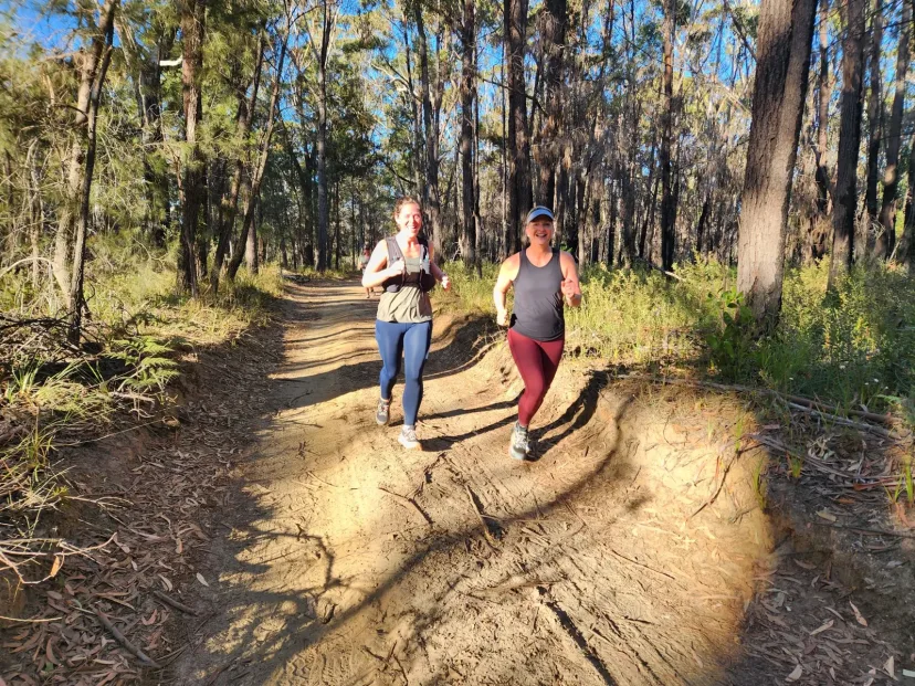 Two Sapphire Coast Runners members running a bush trail together