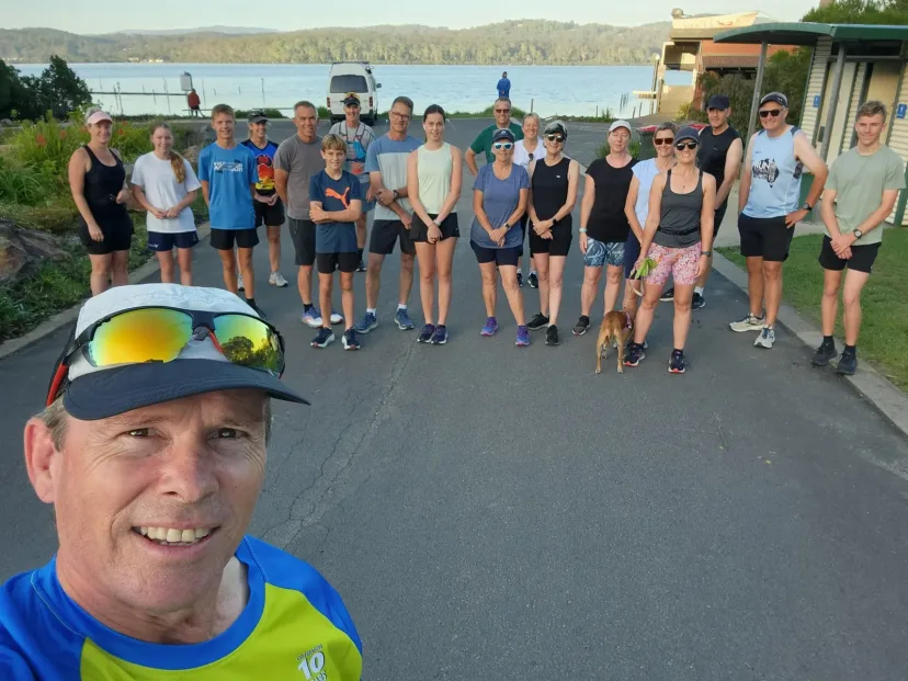 Selfie with Sapphire Coast Runners members running behind