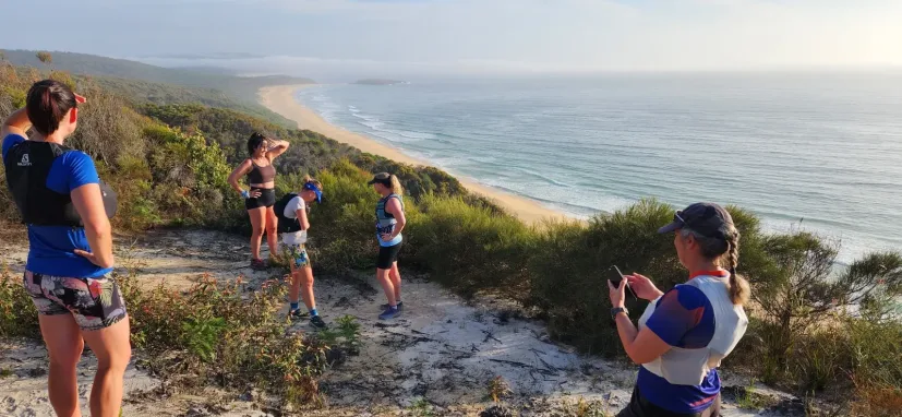 Club member running the coast path above the ocean