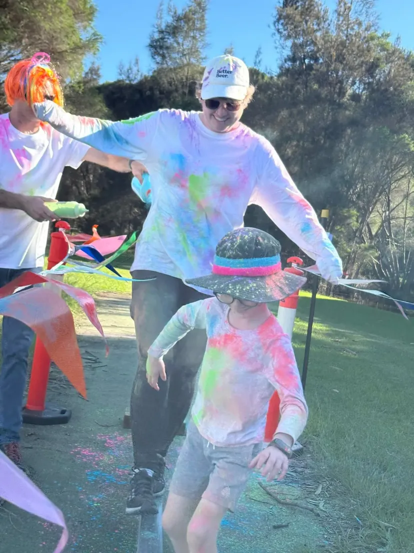 Club members covered in colour at the club colour run