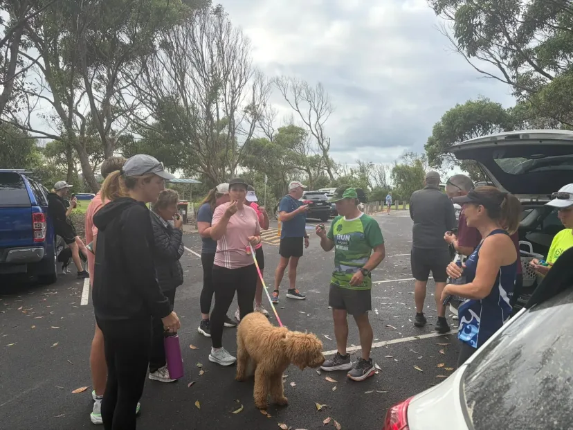 Club members and their dogs before a run