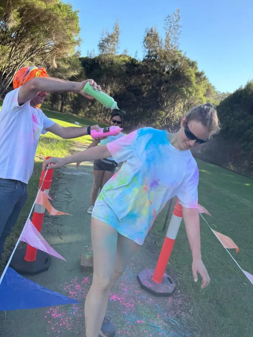 Club members covered in colour at the club colour run