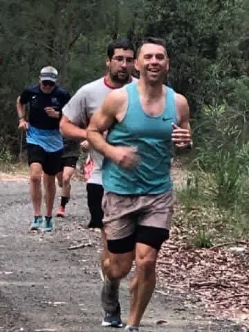 Two Sapphire Coast Runners members running a bush trail together