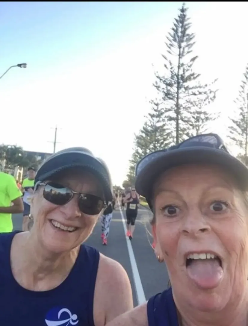 Selfie with Sapphire Coast Runners members running behind