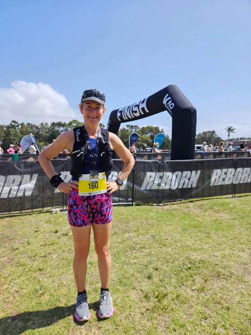 Club member at the finish line of an event