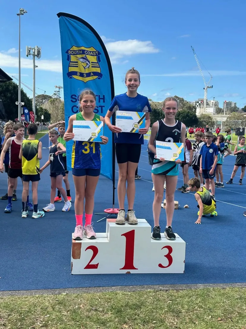 Junior runners on the podium at a carnival