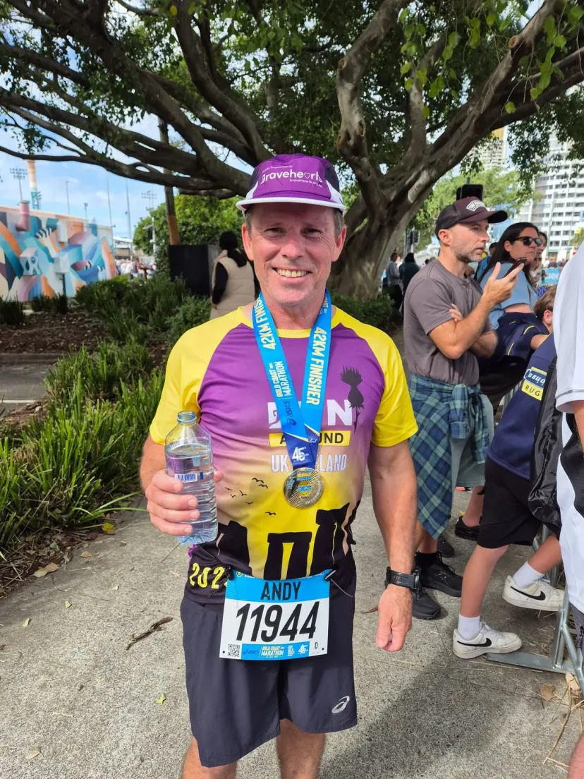 Club member at the finish line of an event