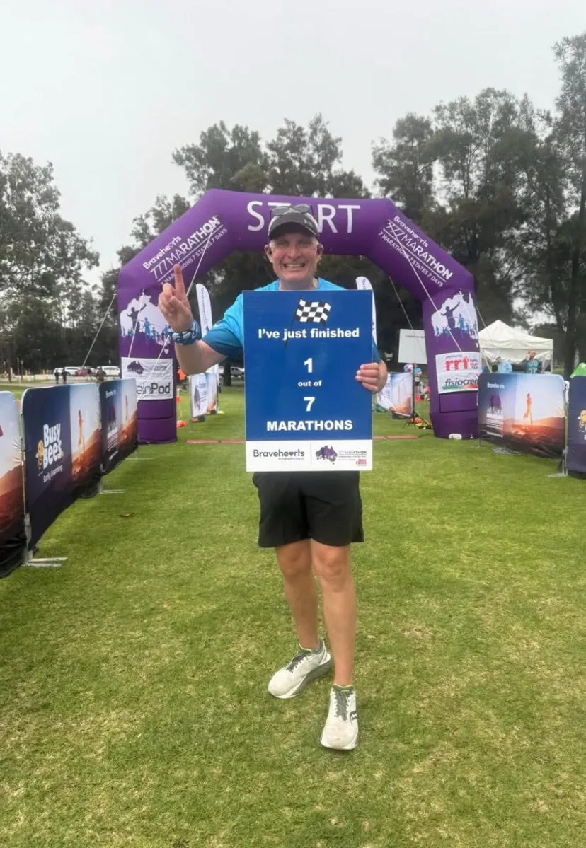 Club member at the finish line of an event