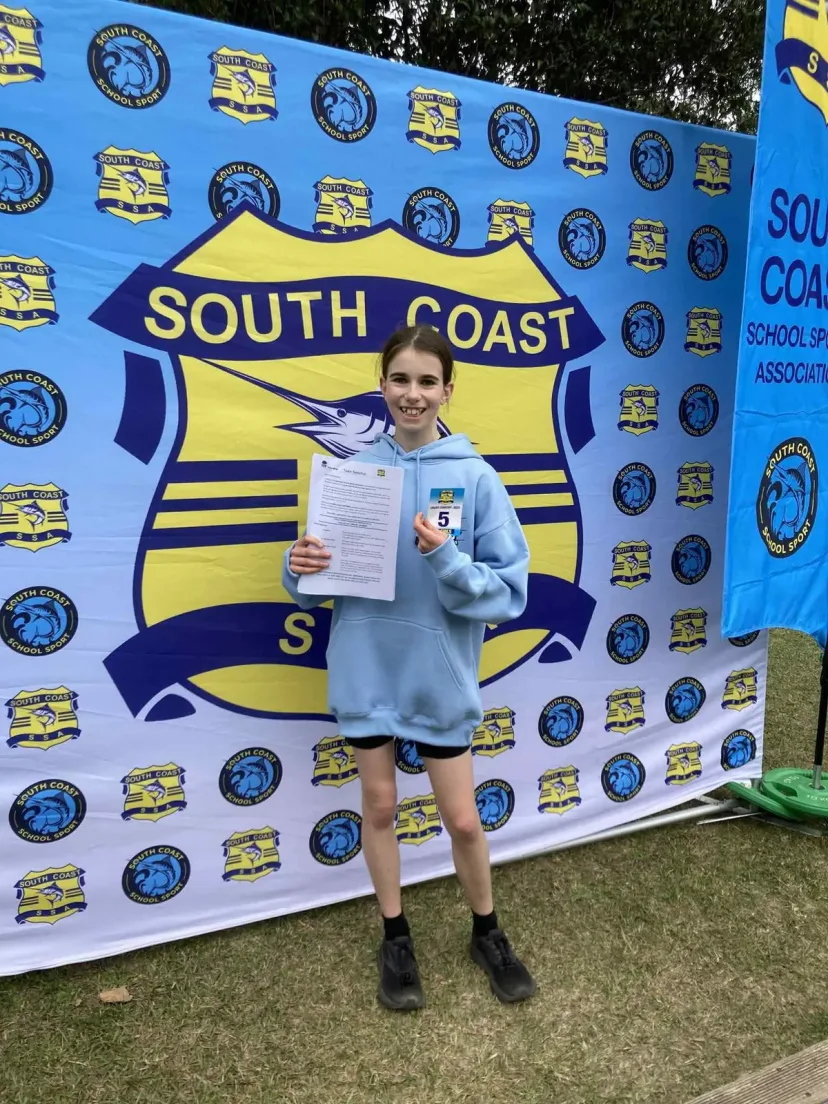 Club member at the finish line of an event