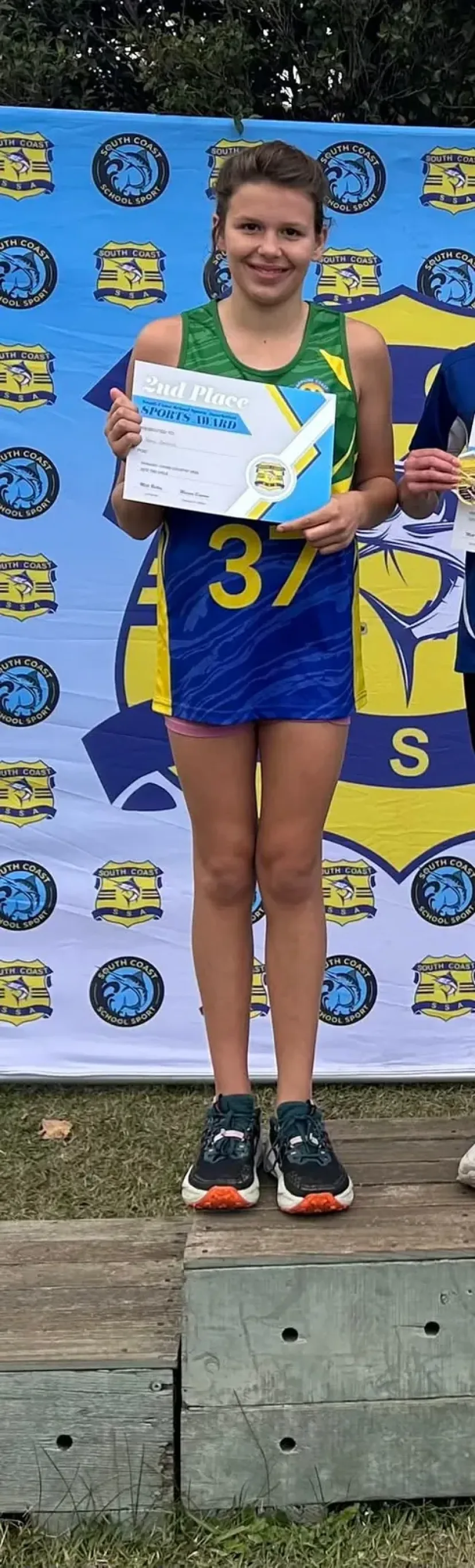 Junior runners on the podium at a carnival