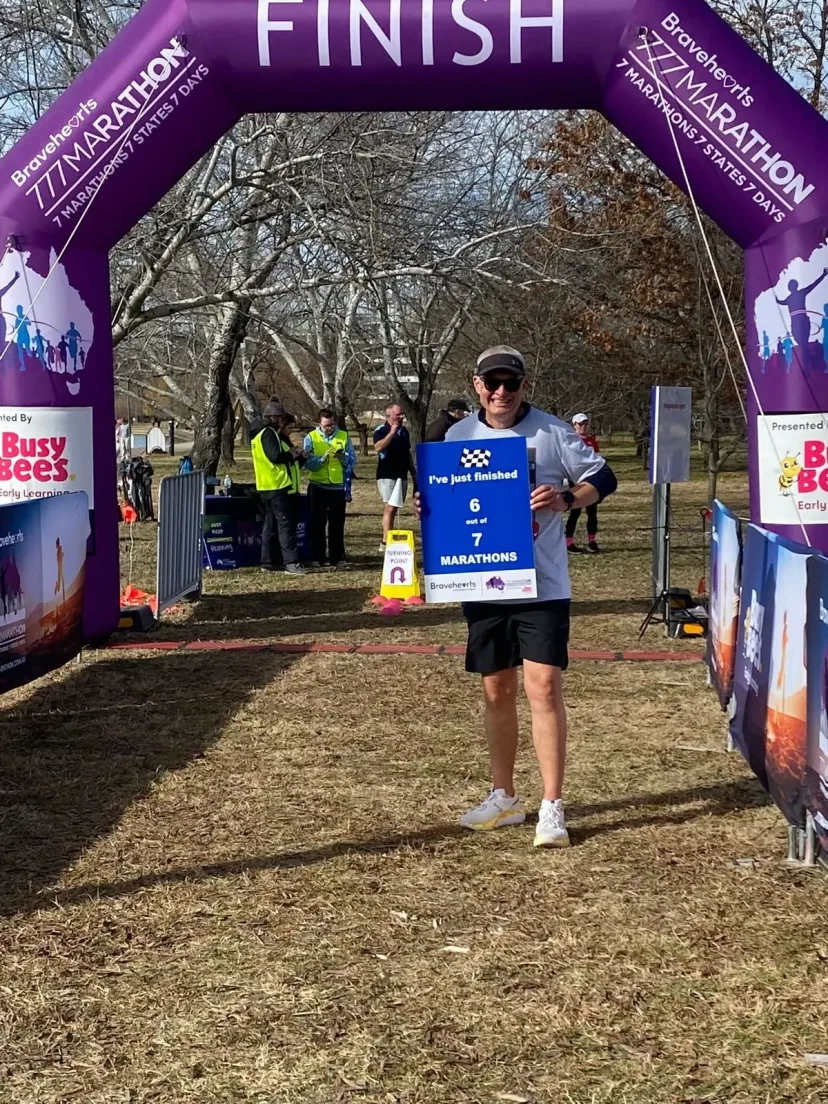Club member at the finish line of an event